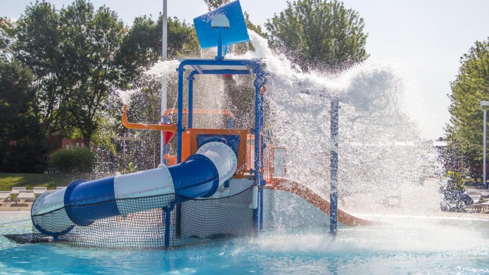 aquatic play zone with dump bucket pouring out water